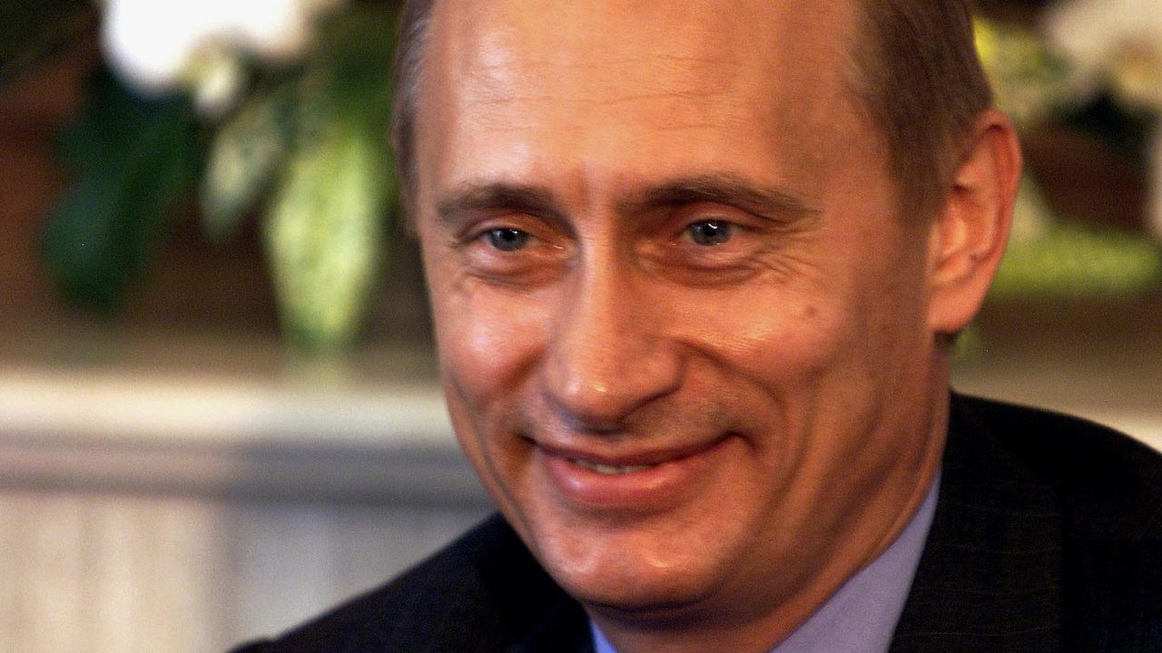 NAGO, JAPAN:  Russian President Vladimir Putin smiles during his bilateral meeting with Canadian Prime Minister Jean Chretien during the Group of Eight (G8) summit in Nago, Okinawa, 23 July 2000.  The leaders of the G8 wrapped up the three-day summit on this southern Japanese island.   (ELECTRONIC IMAGE)   AFP PHOTO/Yoshikazu TSUNO (Photo credit should read YOSHIKAZU TSUNO/AFP via Getty Images)