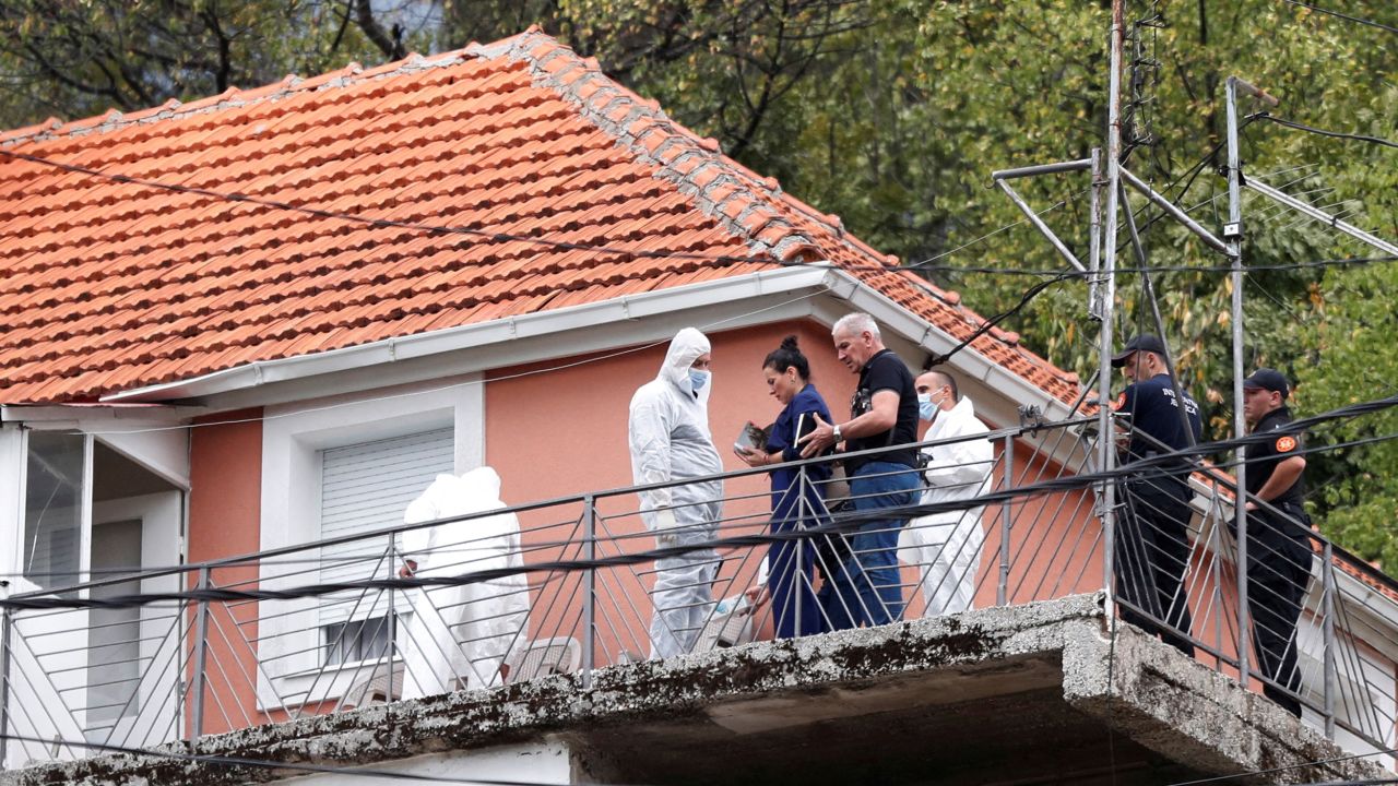 State prosecutor Andrijana Nastic talks to the forensic team at the house where a gunman started a mass shooting in Cetinje, Montenegro August 12, 2022.