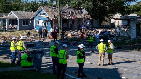 Emergency personnel search the debris left behind by an August 11, 2022, explosion in Evansville, Indiana.