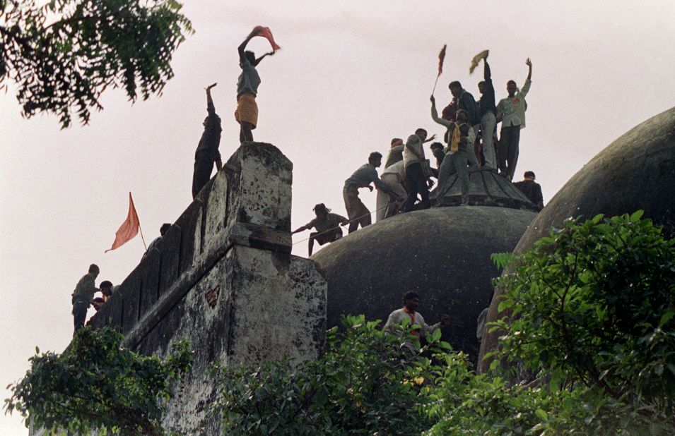 Hindu activists climb on top of the Babri Masjid, five hours before the mosque was demolished by Hindu fundamentalists in 1992. More than 2,000 people -- mostly Muslims -- were killed in nationwide rioting following the demolition, some of the worst violence seen in India since independence.