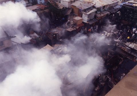 Police fire tear gas during Hindu-Muslim riots in Ahmedabad, Gujarat state, in India on March 3, 2002. 