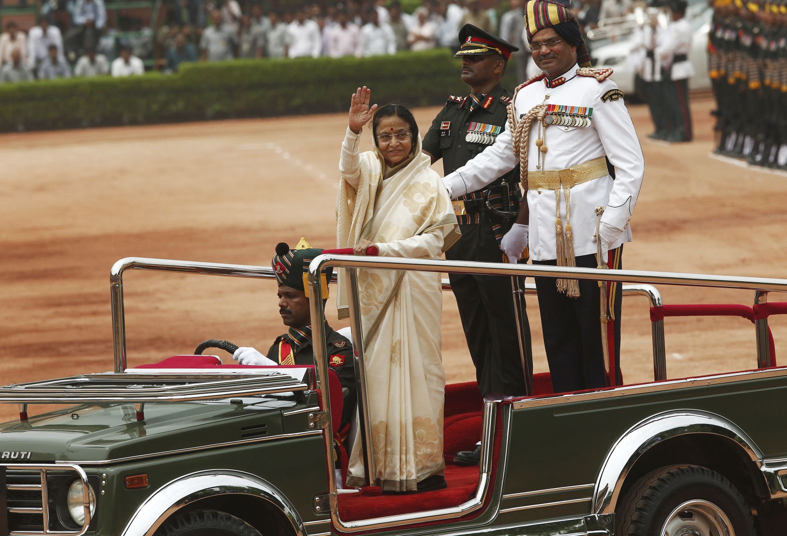 India's first female president Pratibha Patil waves to photographers in New Delhi on July 25, 2012.