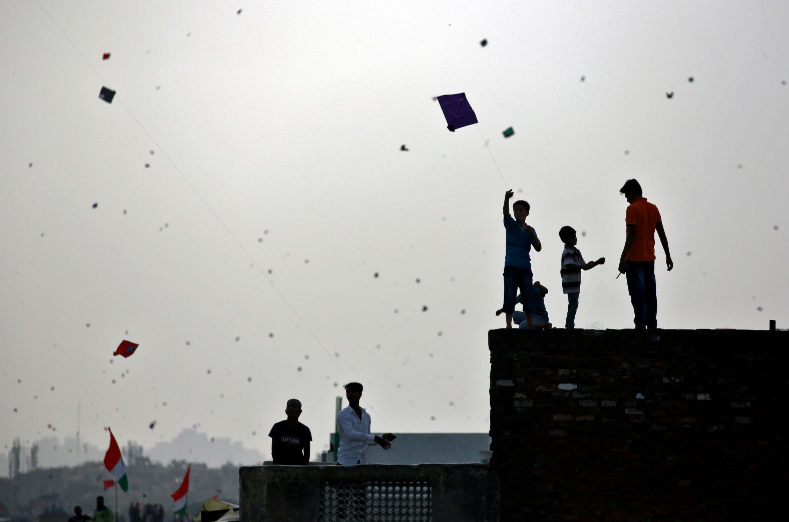 People fly kites from roof tops in Delhi as they celebrate Independence Day, India, August 15, 2017.