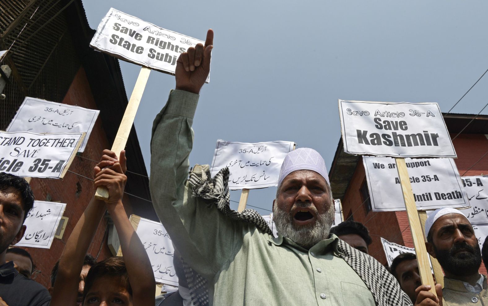 Kashmiri Shiite Muslims shout anti-Indian slogans during a demonstration against attempts to revoke Kashmir's special status, in Srinagar on August 24, 2018. A year later, India's Prime Minister Narendra Modi revoked Article 370, which was in place since 1949 and gave the states of Jammu and Kashmir the power to have their own constitution, flag and autonomy over all matters, save for certain policy areas such as a foreign affairs and defense.
