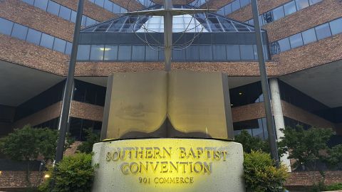 A cross and Bible sculpture stand outside the Southern Baptist Convention headquarters in Nashville on May 24, 2022. 