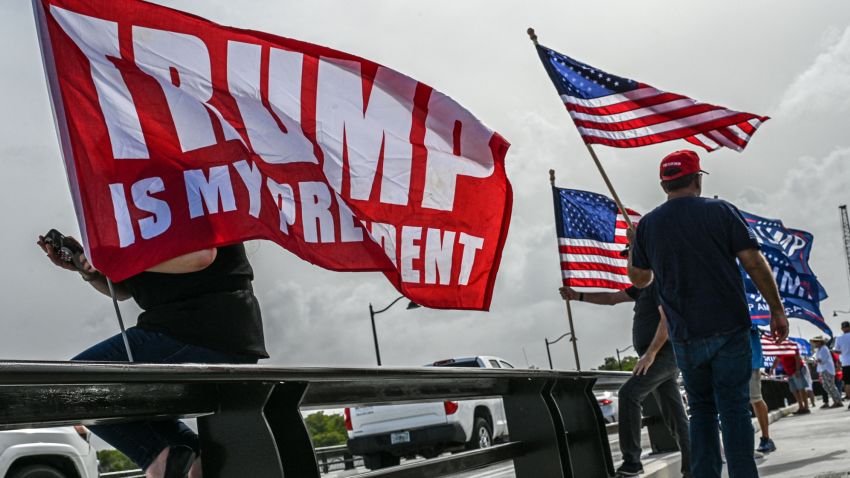 Supporters of former US President Donald Trump gather near his residence at Mar-A-Lago in Palm Beach, Florida, on August 9, 2022. - Former US President Donald Trump said on August 8, 2022, that his Mar-A-Lago residence in Florida was being "raided" by FBI agents in what he called an act of "prosecutorial misconduct." (Photo by Giorgio VIERA / AFP) (Photo by GIORGIO VIERA/AFP via Getty Images)