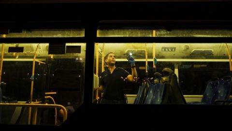 An Israeli police officer checks a bus following a shooting incident in Jerusalem early Sunday morning.