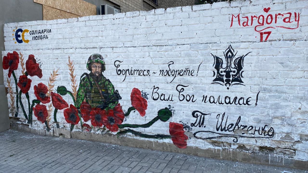 A mural supporting Ukrainian soldiers is seen on a wall in the village of Pokrovske.
