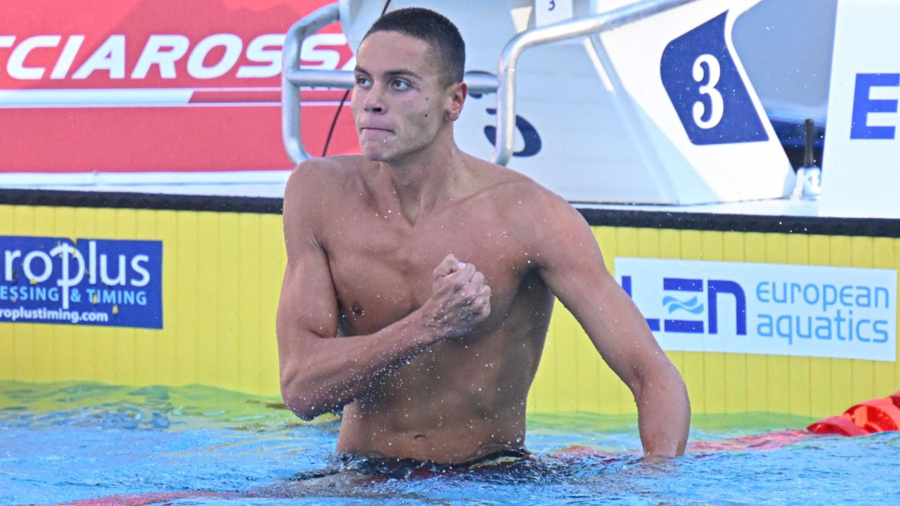 Popovici thumps his chest after setting a world record in the 100m freestyle. 