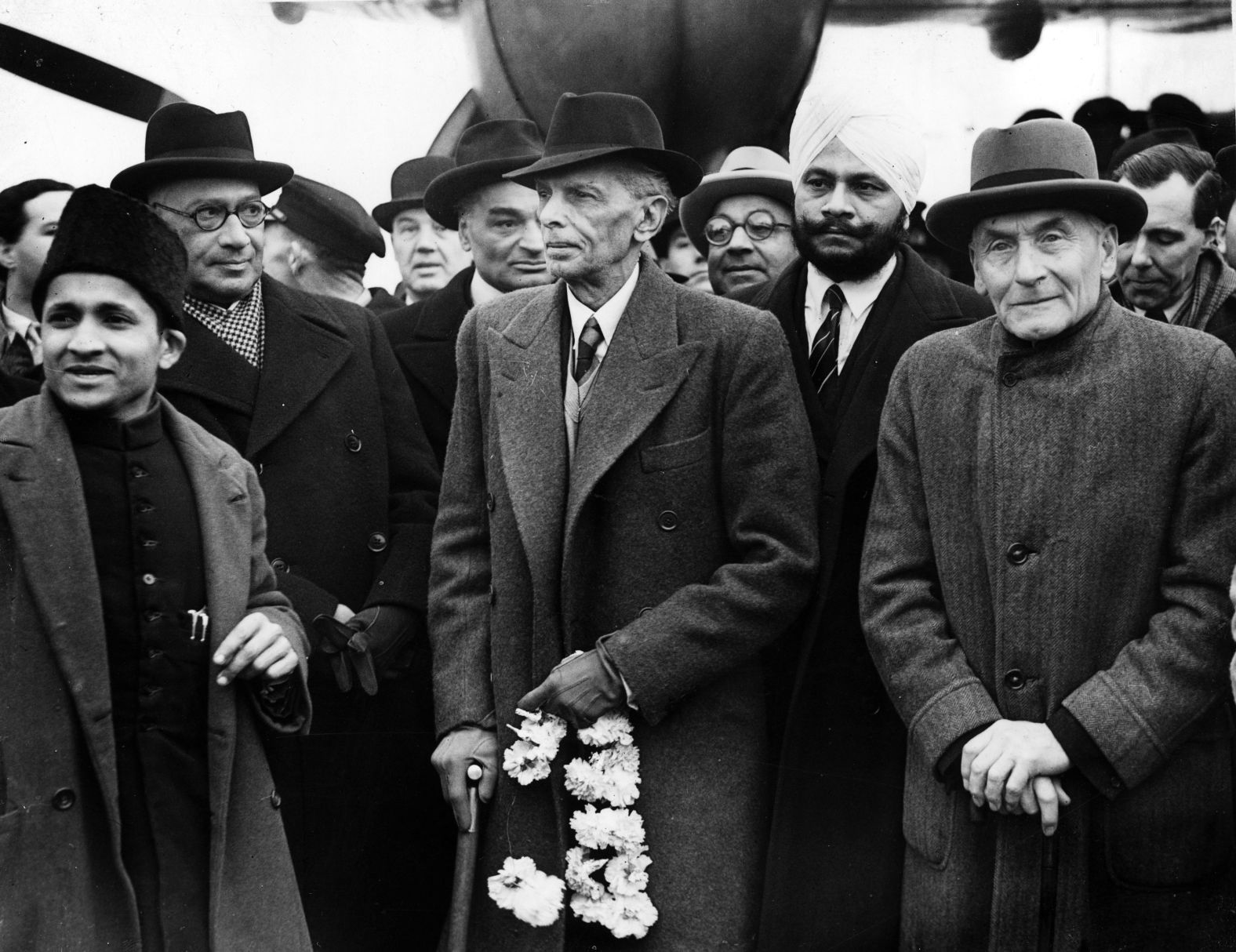 Leader of the All-India Muslim League, Muhammad Ali Jinnah (center), arrives in London on December 3, 1946, with viceroy and governor-general of India Lord Wavell,  Liaquat Ali Khan, Sardar Baldev Singh and Frederick William Pethick-Lawrence, for talks with Britain about the autonomy of Muslims in India, which culminated in the creation of the state of Pakistan.