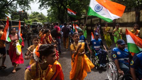 Women in traditional attire participate in a rally to mark the 75th anniversay of India's Independence Day in Mumbai, India, on August 14, 2022.