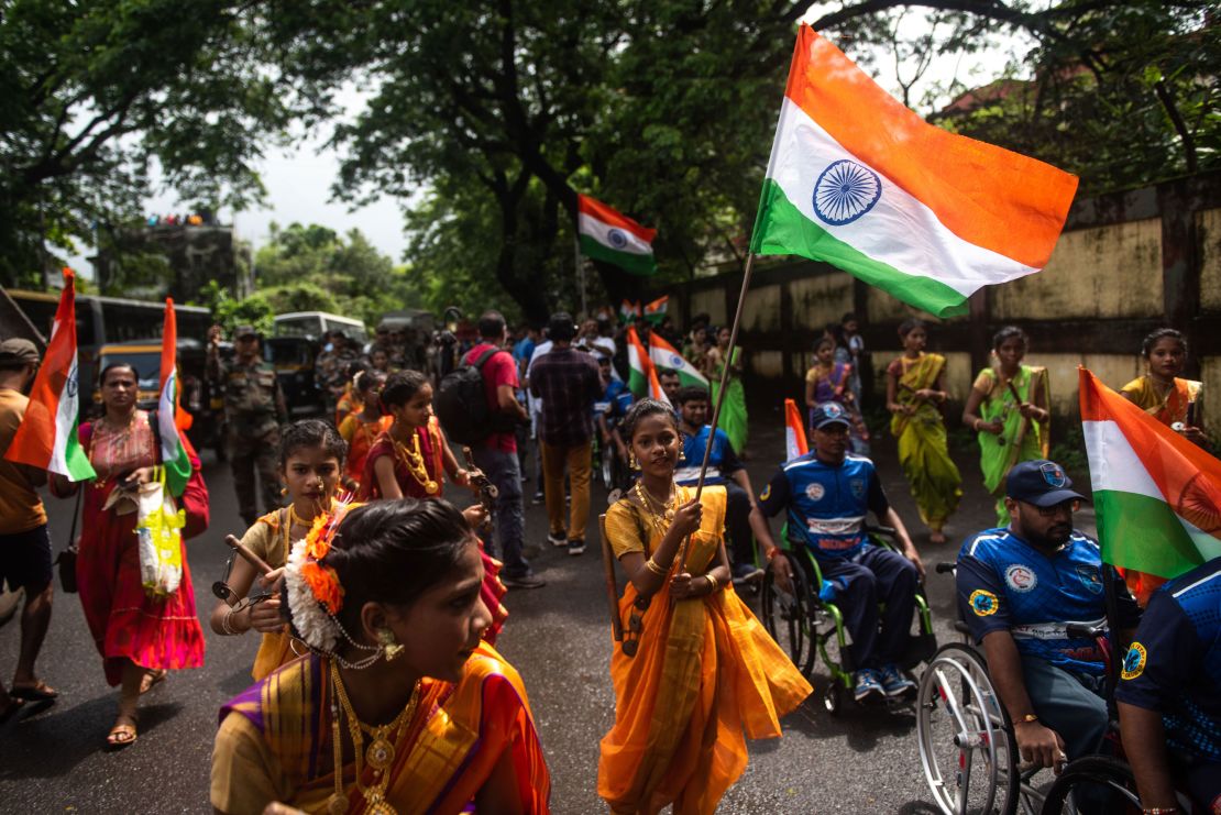 Women in traditional attire participate in a rally to mark the 75th anniversay of India's Independence Day in Mumbai, India, on August 14, 2022.