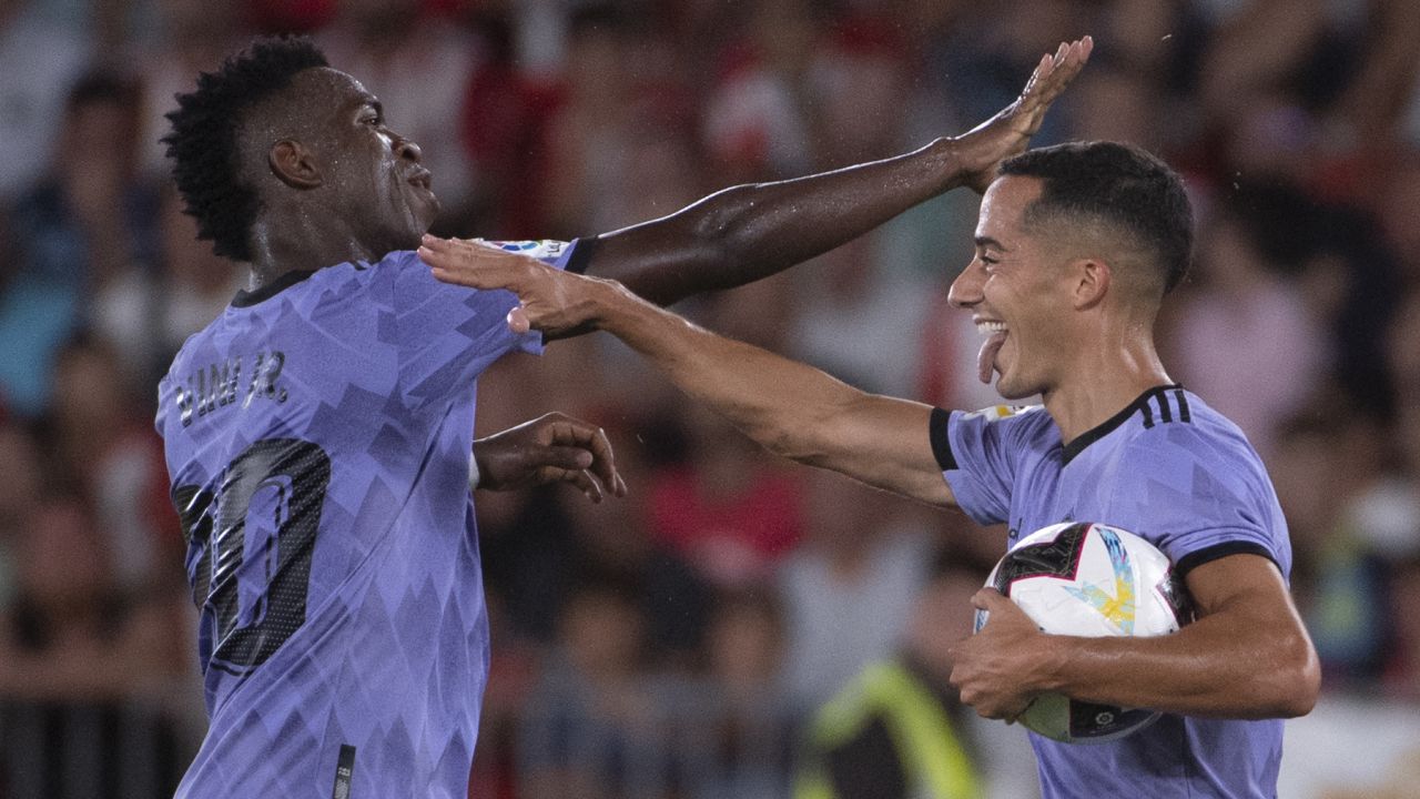Vázquez celebrates scoring the equalizing goal against Almería with Vinicius Júnior.
