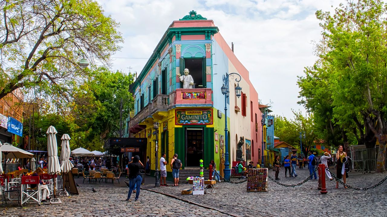 <strong>Buenos Aires:</strong> The main square in the La Boca neighborhood of Buenos Aires features brightly colored buildings and cobblestone streets. The area is a popular destination for watching tango dancers in the street and shopping for souvenir handicrafts made by local artisans.