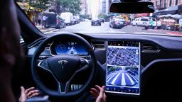 A driver rides hands-free in a Tesla Motors Inc. Model S vehicle equipped with Autopilot hardware and software in New York, U.S. on Monday, Sept. 19, 2016.