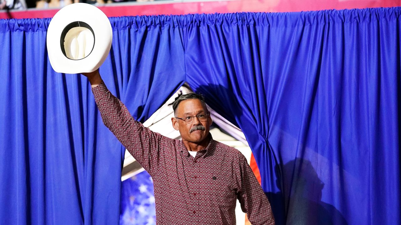 Mark Finchem, a Republican candidate for Arizona Secretary of State, waves to the crowd as he arrives to speak at a Save America rally Friday, July 22, 2022, in Prescott, Ariz.