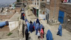 women walking by foot kabul ward pkg 0815