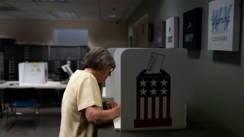 A woman, who declined to give her name, votes early, ahead of Tuesday's Republican primary election in Jackson, Wyo., Monday, Aug. 15, 2022.