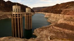 Intake towers for water to enter to generate electricity and provide hydroelectric power stand during low water levels due the western drought on July 19, 2021 at the Hoover Dam on the Colorado River at the Nevada and Arizona state border. - The Lake Mead reservoir formed by the Hoover Dam on the Nevada-Arizona border provides water to the Southwest, including nearby Las Vegas as well as Arizona and California, but has remained below full capacity since 1983 due to increased water demand and drought, conditions that are expected to continue. (Photo by Patrick T. FALLON / AFP) (Photo by PATRICK T. FALLON/AFP via Getty Images)