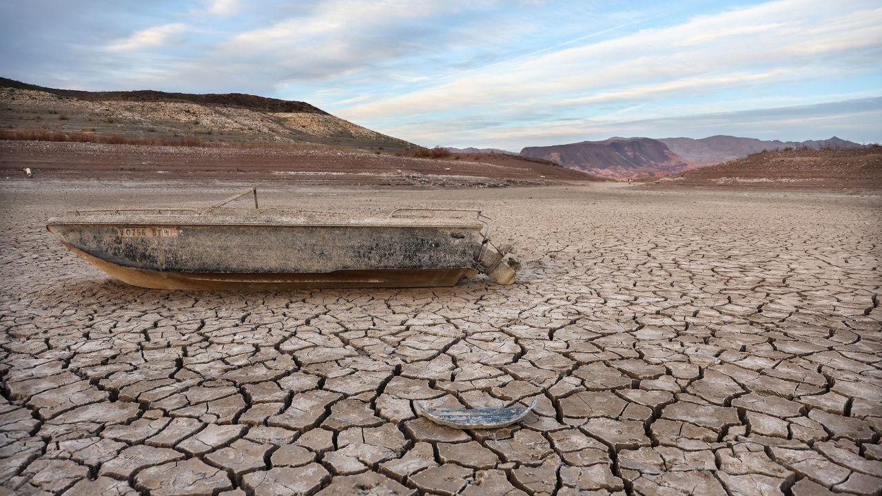 A formerly sunken boat rests on a now-dry section of lakebed of Lake Mead in May.