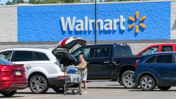COAL TOWNSHIP, PENNSYLVANIA, UNITED STATES - 2022/08/12: A woman loads groceries into her car at a Walmart Supercenter. (Photo by Paul Weaver/SOPA Images/LightRocket via Getty Images)