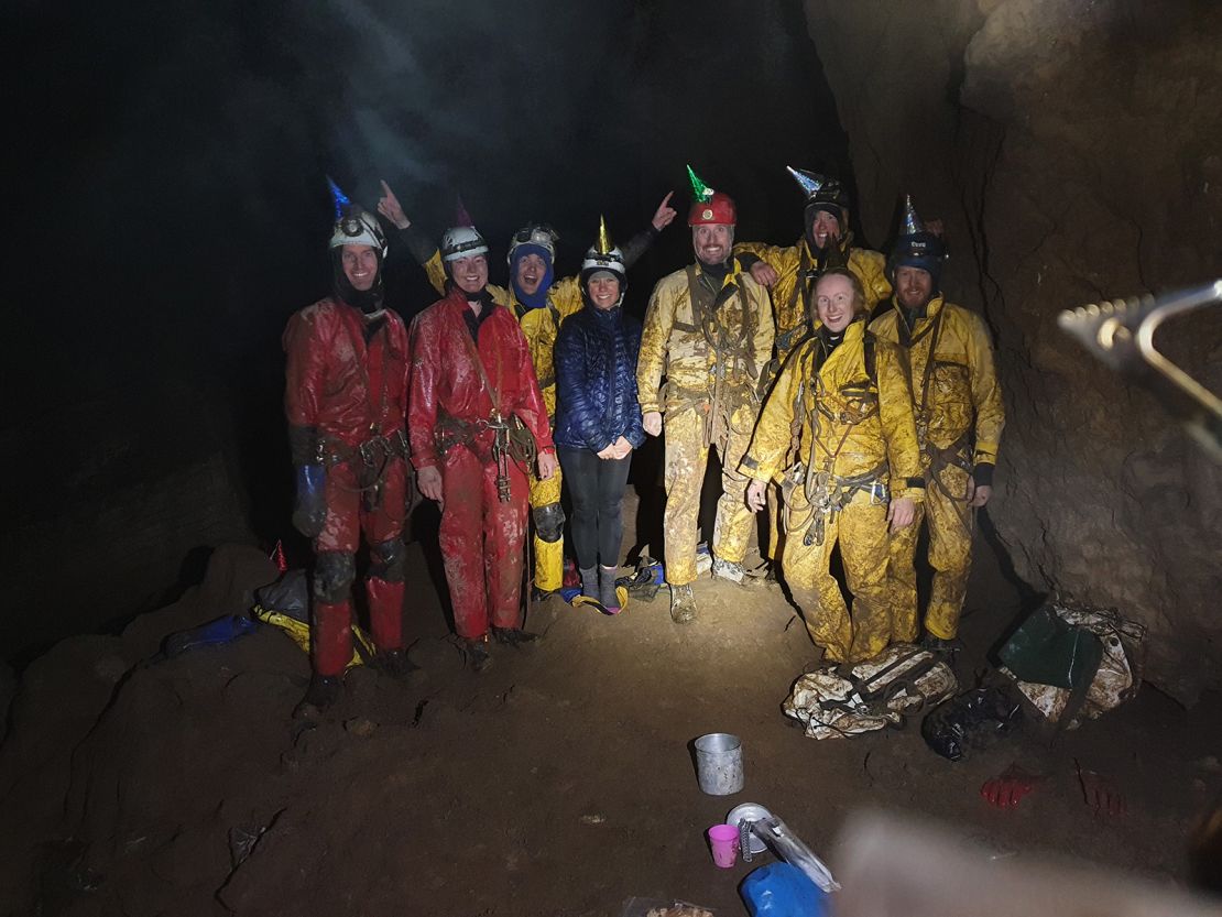 The cavers celebrate making it to the bottom of Delta Variant.