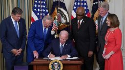 US President Joe Biden signs the Inflation Reduction Act of 2022 into law during a ceremony in the State Dining Room of the White House in Washington, DC, on August 16, 2022. (Photo by MANDEL NGAN / AFP) (Photo by MANDEL NGAN/AFP via Getty Images)