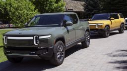 A Rivian R1T Truck and R1S SUV is parked outside the Allen & Company Sun Valley Conference on July 08, 2022 in Sun Valley, Idaho. 