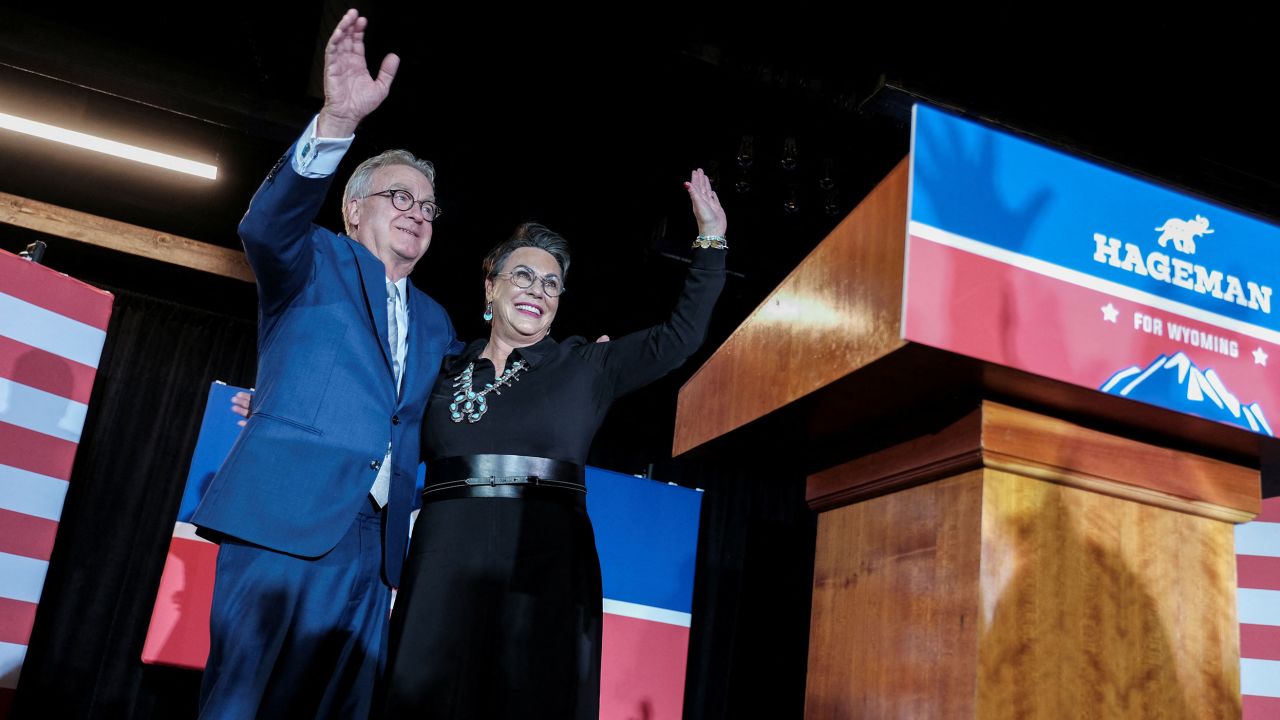 Republican congressional candidate Harriet Hageman waves, along with her husband, John Sundahl, during her election night party in Cheyenne, Wyoming, on August 16, 2022.