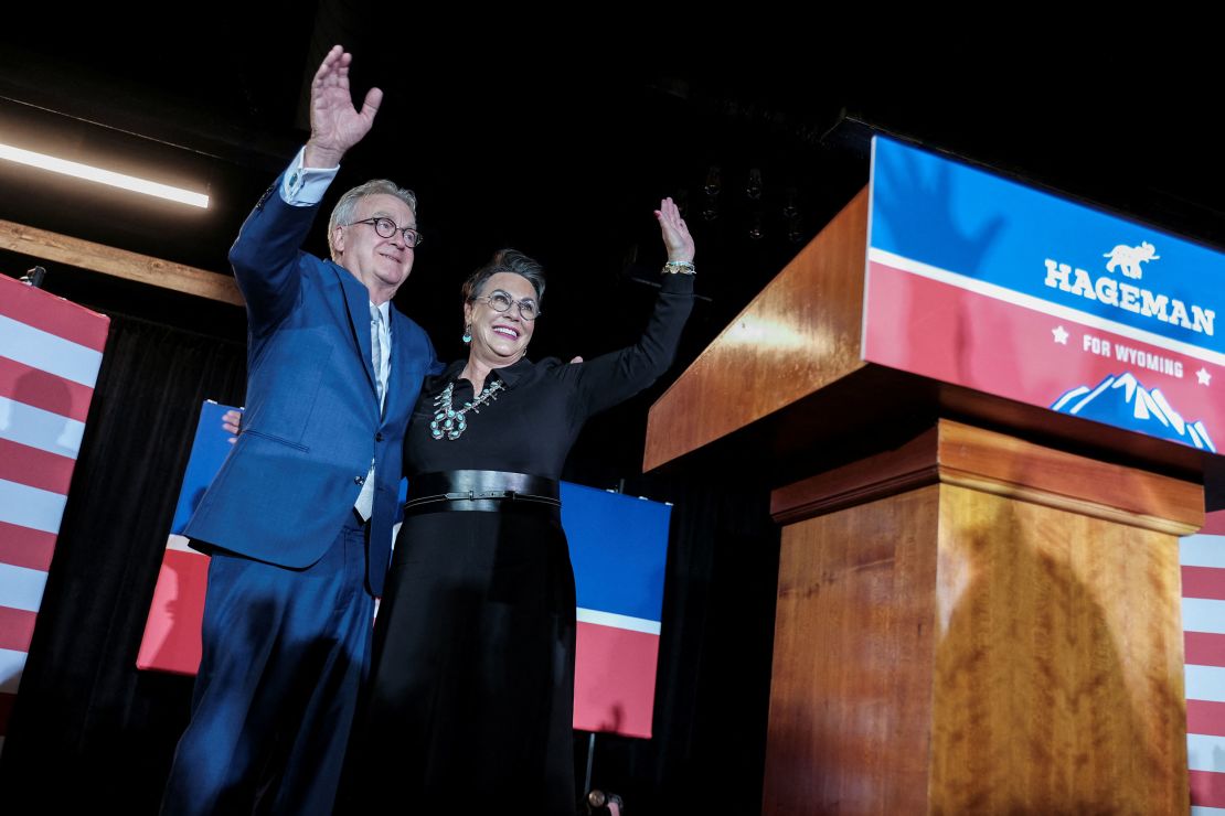 Republican congressional candidate Harriet Hageman waves, along with her husband, John Sundahl, during her election night party in Cheyenne, Wyoming, on August 16, 2022. 