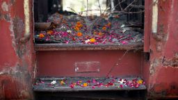 Flower petals scattered by the relatives of Gujarat riots victims at the doorsteps of a train carriage, that was set on fire in 2002, during the commemoration of the 12th anniversary of Godhra riots at Godhra in the western Indian state of Gujarat February 27, 2014. 