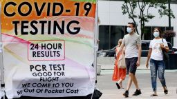 People wear masks near a Covid-19 walk-up testing site on July 6 in New York City. 