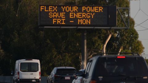 A Flex Alert advisory message shows on a message board on Interstate 710 in July 2021 in Long Beach, California.