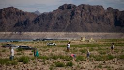 People walk by Swim Beach at Lake Mead National Recreation Area