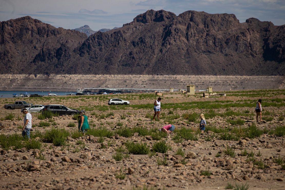 Visitors walk by Swim Beach at the Lake Mead National Recreation Area in August.