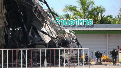 Thai bomb squad personnel inspect the damage at the Bangchak gas station after an attack, in Nong Chik district in southern Thailand's Pattani province, on August 17.