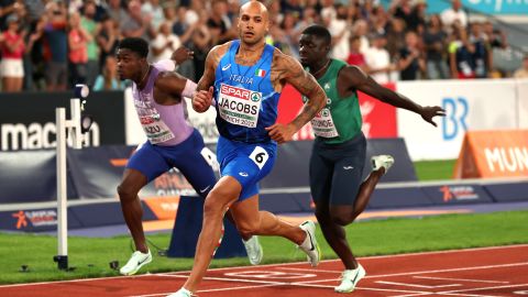 Jacobs crosses the finish line during the men's 100m final at the 2022 European Championships.
