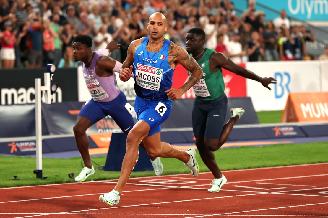 Jacobs crosses the finish line during the men's 100m final at the 2022 European Championships.