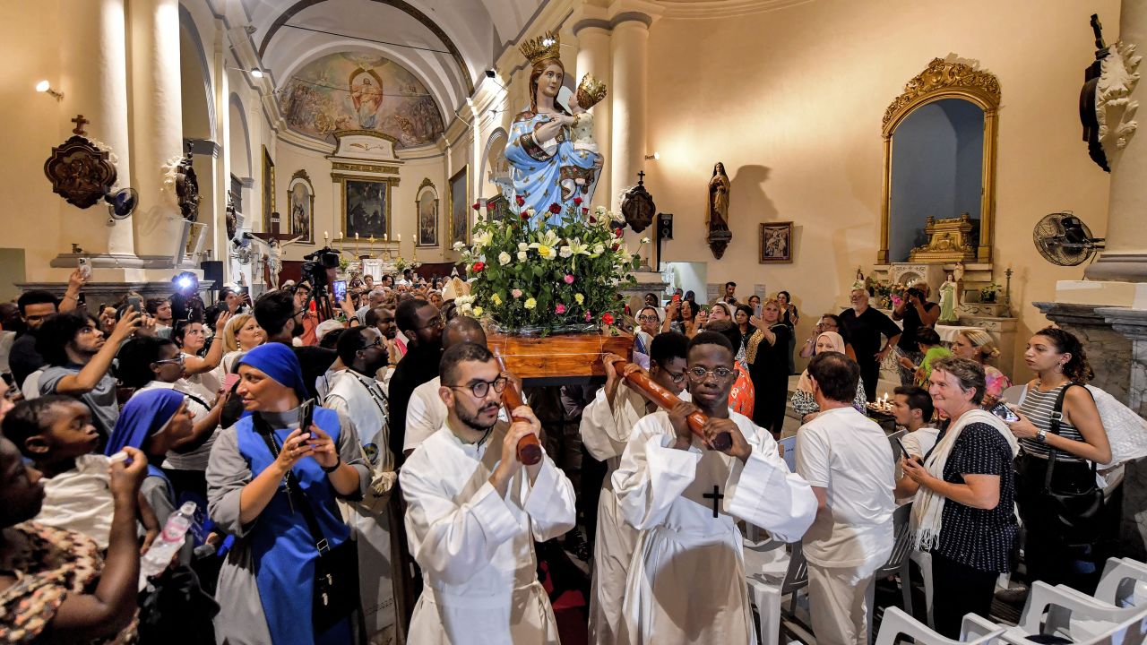 Worshippers carry the shrine of the Madonna of Trapani during the procession in the annual Roman Catholic feast day of the Assumption of the Virgin Mary at the Saint-Augustin and Saint-Fidèle church in La Goulette suburb of Tunisia's capital Tunis on August 15. 