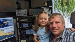Isabella and her dad, Matthew Payne, 42 with his radio equipment.
