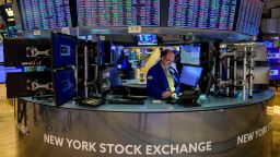 Traders work during the opening bell at the New York Stock Exchange (NYSE) on Wall Street in New York City on August 16, 2022. - Wall Street stocks were mostly lower early Tuesday following lackluster housing data and as Walmart results highlighted how inflation is altering consumer behavior.
