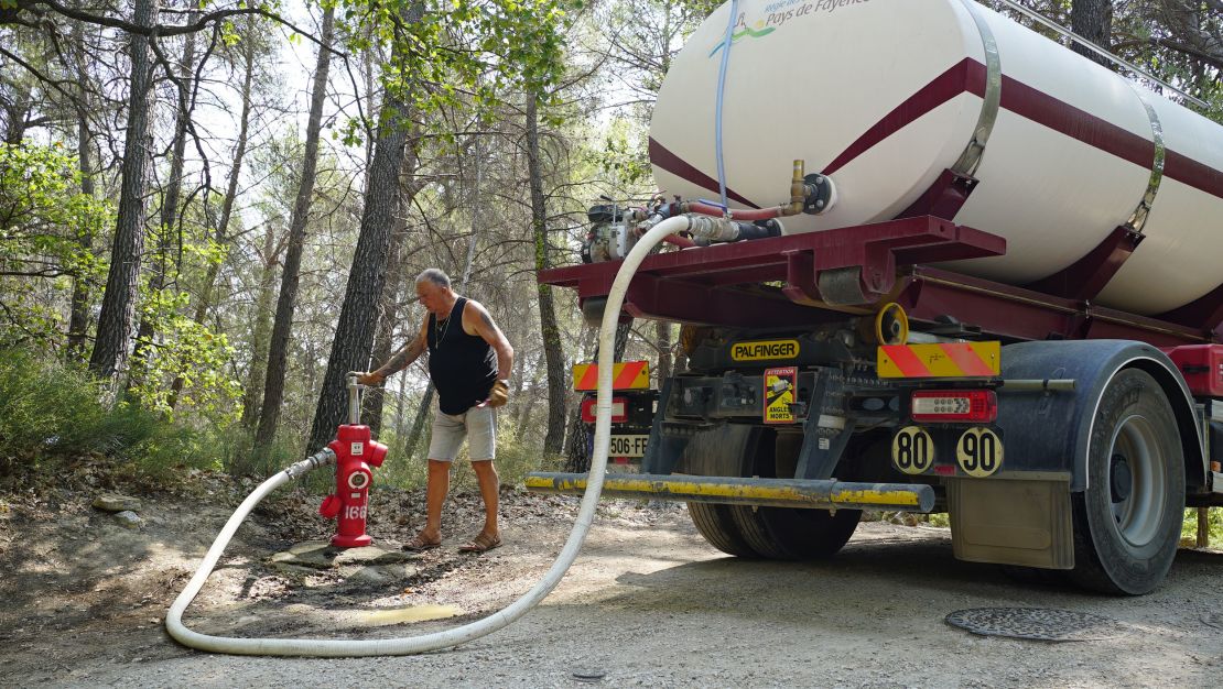 Daniel Martel fills a water truck bought by local authorities in the village of Seillans to replenish reservoirs in a district that has run out of tap water.                            