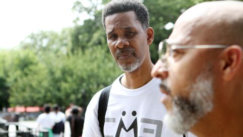 Clinton Lacy listens to Bishop David Maldonado at  Maria Hernandez Park, in Bushwick, Brooklyn, on July 31, 2022.