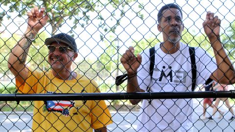 Antonio Fernandez, left, and Clinton Lacy walk through Maria Hernandez Park in Bushwick, Brooklyn, on July 31, 2022.