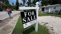 A 'for sale' sign hangs in front of a home on June 21, 2022 in Miami, Florida. 