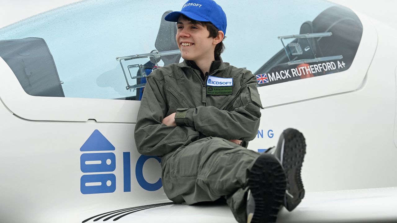 British-Belgian teenage pilot Mack Rutherford poses during a photocall to promote his attempt to be the youngest male to make a round-the-world solo flight, at Biggin Hill Airfield, south east of London on February 15, 2022. - Sixteen year old Rutherford is aiming to fly a Shark ultralight aircraft during his circumnavigation, flying in the opposite direction to his sister Zara Rutherford, who in January 2022 became the youngest female to complete a solo round-the-world flight. (Photo by Glyn KIRK / AFP) (Photo by GLYN KIRK/AFP via Getty Images)