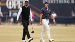Tiger Woods of The USA and Rory McIlroy of Northern Ireland on the 18th fairway  during the Celebration of Champions prior to The 150th Open at St Andrews Old Course on July 11, 2022 in St Andrews, Scotland. 