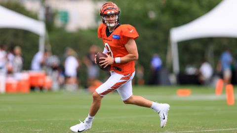 Burrow looks for a receiver during Bengals training camp.