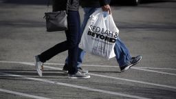 A customer carries a Bed Bath & Beyond Inc. shopping bag outside a store in Clarksville, Indiana, U.S., on Sunday, Jan. 5, 2020.