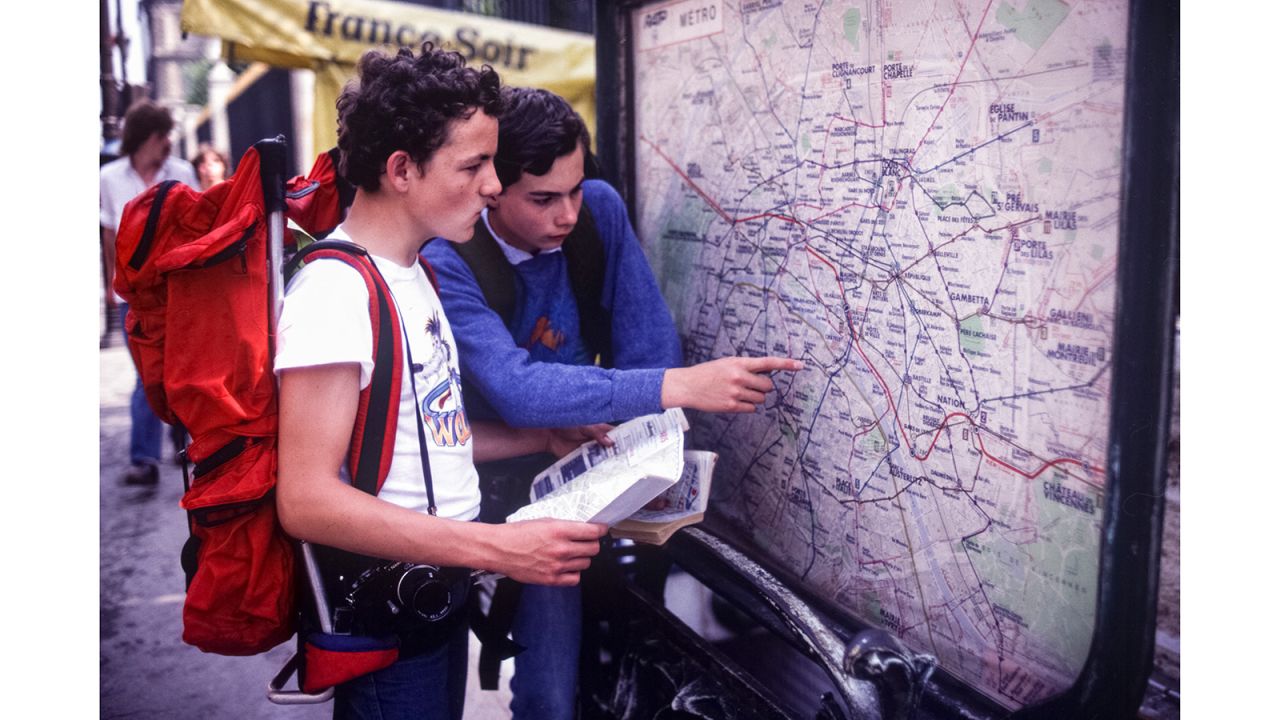 <strong>'Où est la gare?': </strong>Back in 1981, travelers like these boys in Paris had to consult a metro map to figure out how to get around. 